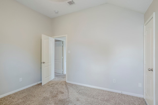 16511 Bluefin St, Crosby, TX 77532 - unfurnished room featuring light colored carpet, baseboards, vaulted ceiling, and a smoke detector
