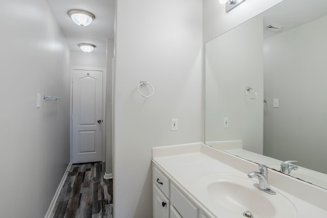 16511 Bluefin St, Crosby, TX 77532 - bathroom featuring wood finished floors, vanity, and baseboards