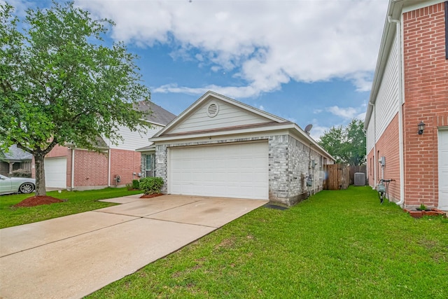 1810 Macondray Dr, Humble, TX 77396 - view of front of house featuring driveway, central air condition unit, and a garage