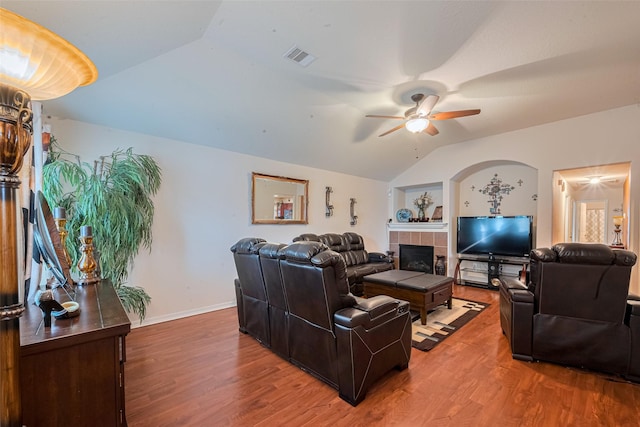 1810 Macondray Dr, Humble, TX 77396 - living area with lofted ceiling, a fireplace, wood finished floors, ceiling fan, and baseboards