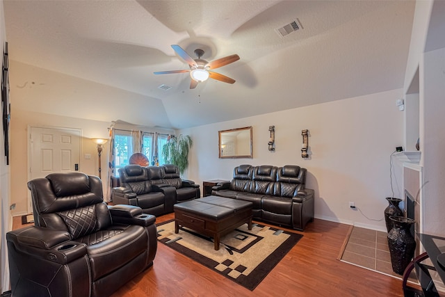 1810 Macondray Dr, Humble, TX 77396 - living room featuring a ceiling fan, vaulted ceiling, wood finished floors, and baseboards