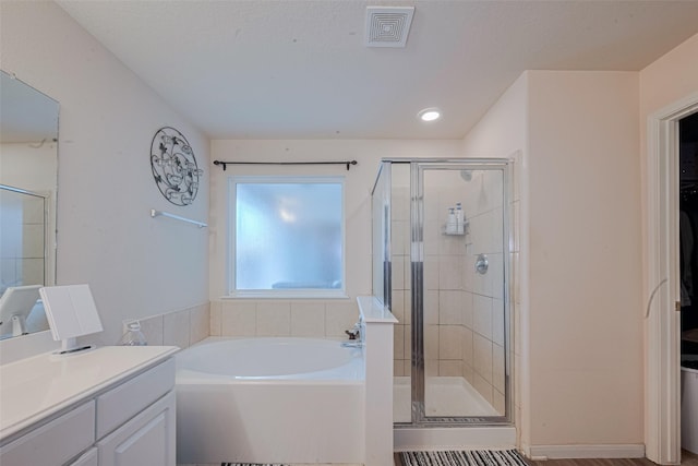1810 Macondray Dr, Humble, TX 77396 - full bathroom with a garden tub, vanity, a shower stall, and recessed lighting