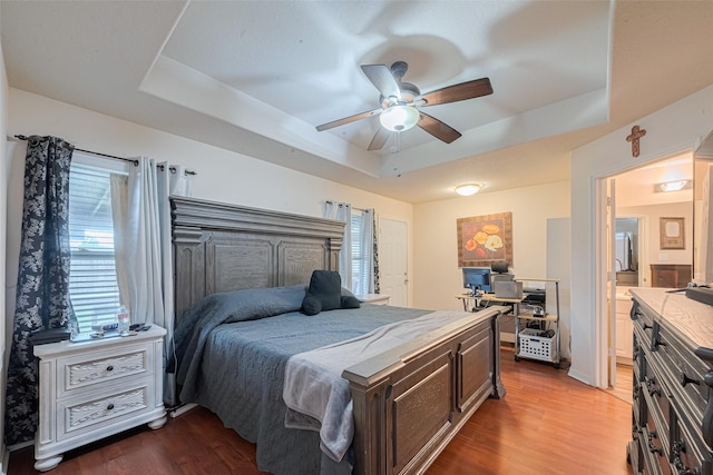 1810 Macondray Dr, Humble, TX 77396 - bedroom with a raised ceiling, wood finished floors, and ceiling fan