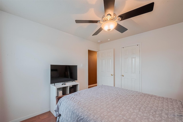 1810 Macondray Dr, Humble, TX 77396 - bedroom with wood finished floors, baseboards, and ceiling fan