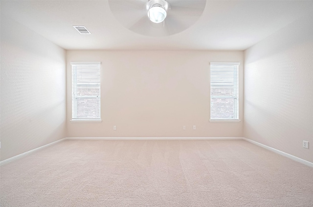 18827 Waverly Springs Ln, Cypress, TX 77429 - unfurnished room featuring ceiling fan, light colored carpet, and baseboards