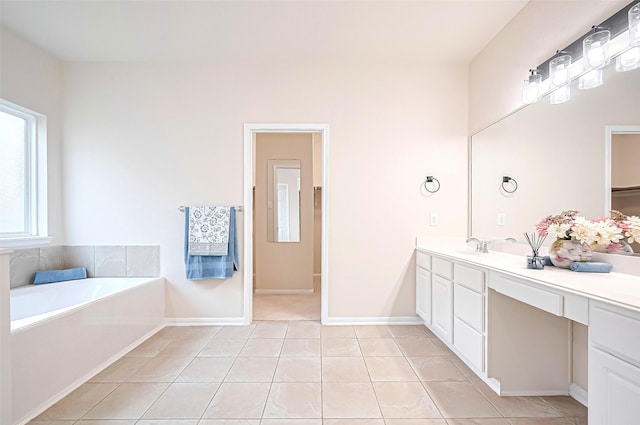 18827 Waverly Springs Ln, Cypress, TX 77429 - bathroom with vanity, tile patterned flooring, a bath, and baseboards