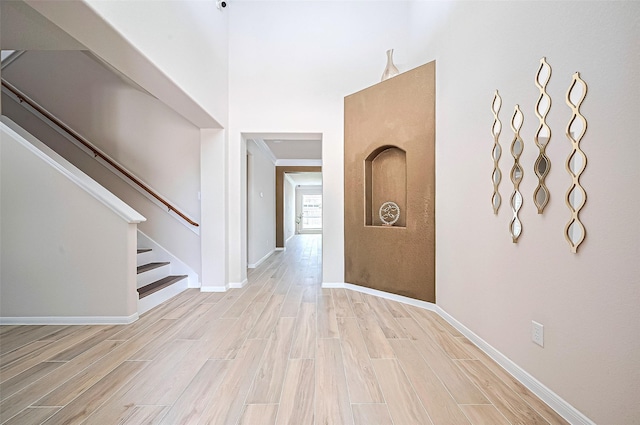 18827 Waverly Springs Ln, Cypress, TX 77429 - foyer entrance featuring light wood finished floors, stairway, and baseboards