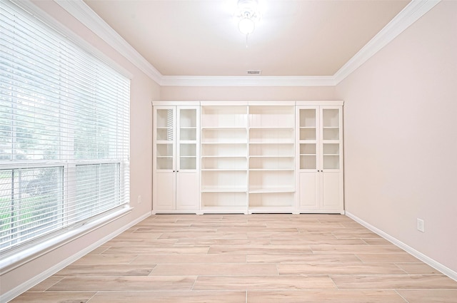 18827 Waverly Springs Ln, Cypress, TX 77429 - empty room featuring light wood-style flooring, ornamental molding, and baseboards