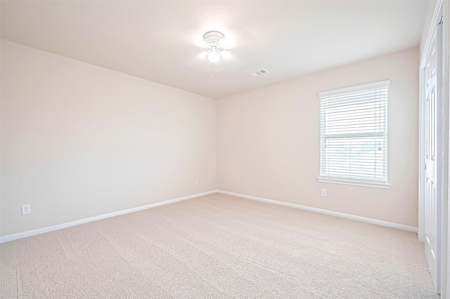 18827 Waverly Springs Ln, Cypress, TX 77429 - spare room featuring baseboards and light carpet