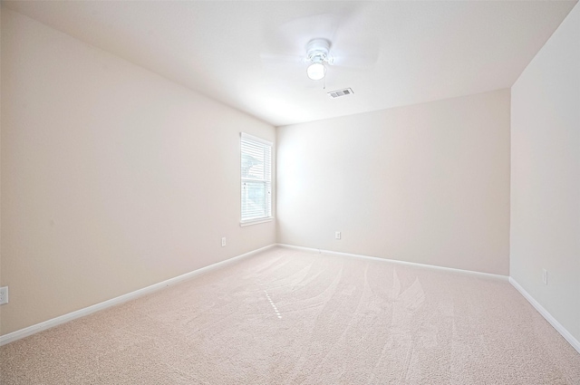 18827 Waverly Springs Ln, Cypress, TX 77429 - spare room featuring light colored carpet, baseboards, and ceiling fan