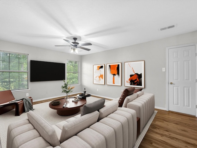 3910 Echo Mountain Dr, Kingwood, TX 77345 - living area with ceiling fan, wood finished floors, and baseboards