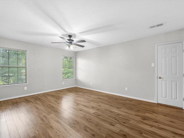 3910 Echo Mountain Dr, Kingwood, TX 77345 - unfurnished room featuring a ceiling fan, wood finished floors, and baseboards