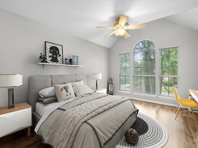 3910 Echo Mountain Dr, Kingwood, TX 77345 - bedroom featuring lofted ceiling, wood finished floors, and ceiling fan