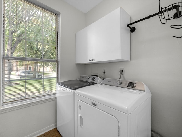 3910 Echo Mountain Dr, Kingwood, TX 77345 - laundry room featuring cabinet space, washing machine and dryer, and baseboards