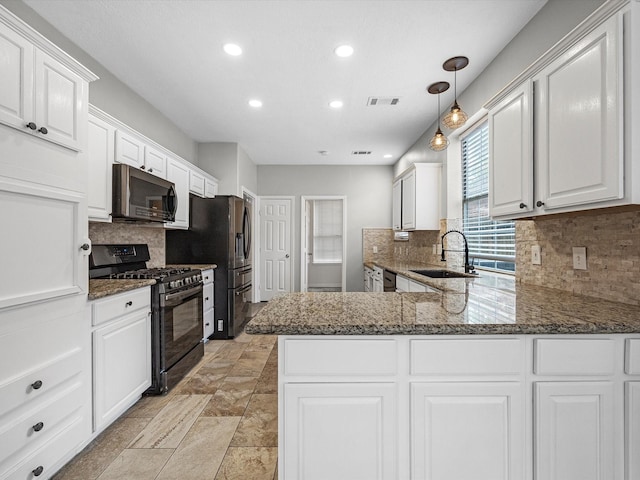 3910 Echo Mountain Dr, Kingwood, TX 77345 - kitchen with gas stove, a sink, recessed lighting, white cabinetry, and decorative backsplash