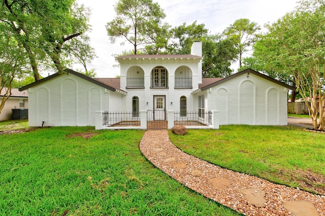 127 Red Bud Ln, Baytown, TX 77520 - view of front of home featuring a chimney and central AC unit