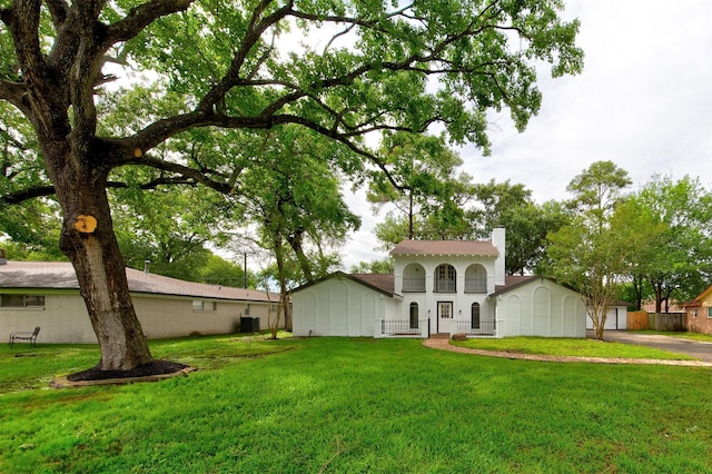 127 Red Bud Ln, Baytown, TX 77520 - mediterranean / spanish home with a chimney and central AC