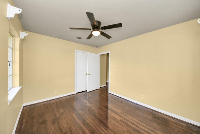 149 E Riverwood Dr, Houston, TX 77076 - unfurnished bedroom featuring wood finished floors, baseboards, and a ceiling fan