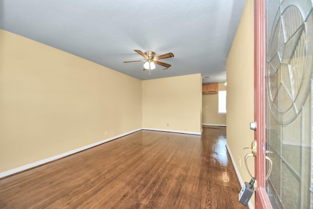 149 E Riverwood Dr, Houston, TX 77076 - foyer featuring dark wood-style flooring, baseboards, and ceiling fan