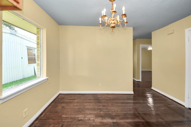 149 E Riverwood Dr, Houston, TX 77076 - unfurnished room with a chandelier, baseboards, and wood finished floors
