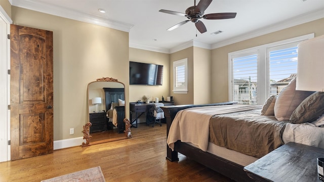 5215 Feagan St Unit A, Houston, TX 77007 - bedroom featuring wood finished floors, baseboards, recessed lighting, ornamental molding, and a ceiling fan