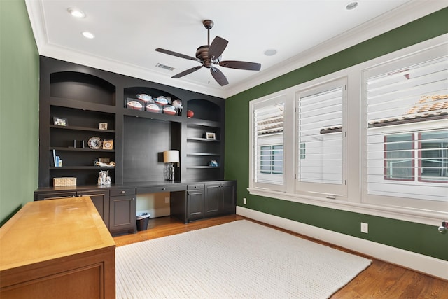 5215 Feagan St Unit A, Houston, TX 77007 - unfurnished office with built in study area, crown molding, wood finished floors, a ceiling fan, and baseboards