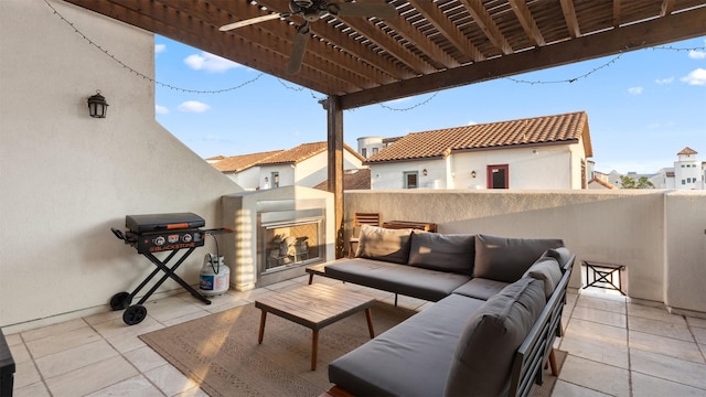 5215 Feagan St Unit A, Houston, TX 77007 - view of patio / terrace with an outdoor living space with a fireplace, grilling area, a ceiling fan, and a residential view