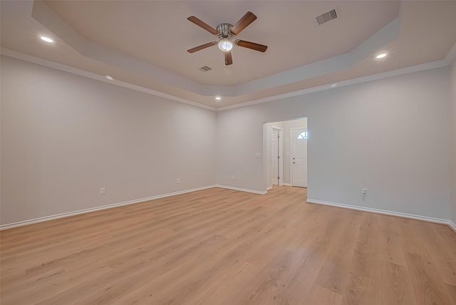 4523 Nexus Rd, Houston, TX 77053 - unfurnished room featuring a ceiling fan, recessed lighting, a tray ceiling, light wood-style floors, and baseboards