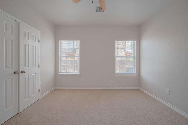 4523 Nexus Rd, Houston, TX 77053 - unfurnished bedroom with light carpet, baseboards, and a ceiling fan