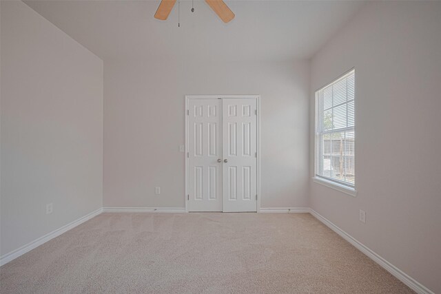 4523 Nexus Rd, Houston, TX 77053 - unfurnished bedroom featuring light carpet, baseboards, a closet, and a ceiling fan