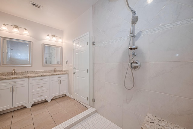 4523 Nexus Rd, Houston, TX 77053 - full bath featuring a tile shower, double vanity, and tile patterned flooring