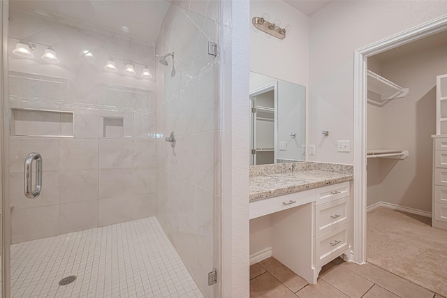 4523 Nexus Rd, Houston, TX 77053 - bathroom featuring a shower stall, tile patterned floors, vanity, and a walk in closet