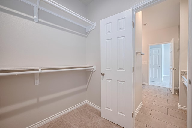 4523 Nexus Rd, Houston, TX 77053 - walk in closet featuring light tile patterned floors