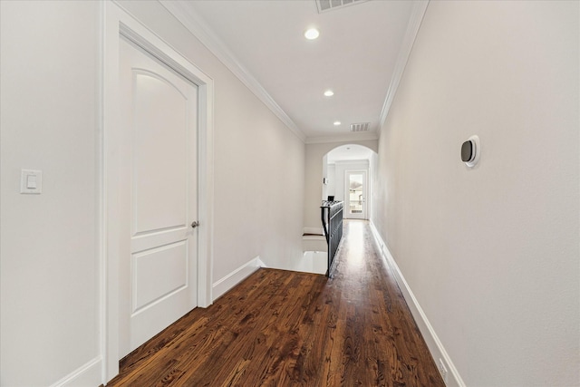 5204 Chestnut St, Bellaire, TX 77401 - corridor featuring crown molding, arched walkways, wood finished floors, baseboards, and recessed lighting