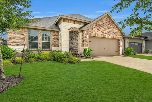 28403 Hannahs Harbor Ln, Katy, TX 77494 - view of front of house featuring brick siding, a garage, a front lawn, driveway, and roof with shingles