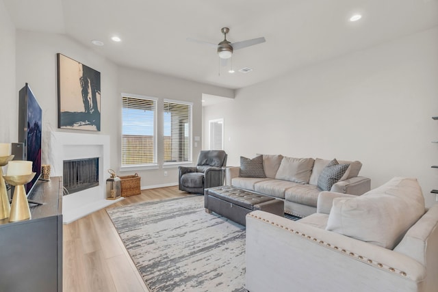 28403 Hannahs Harbor Ln, Katy, TX 77494 - living area featuring ceiling fan, wood finished floors, a fireplace, recessed lighting, and baseboards