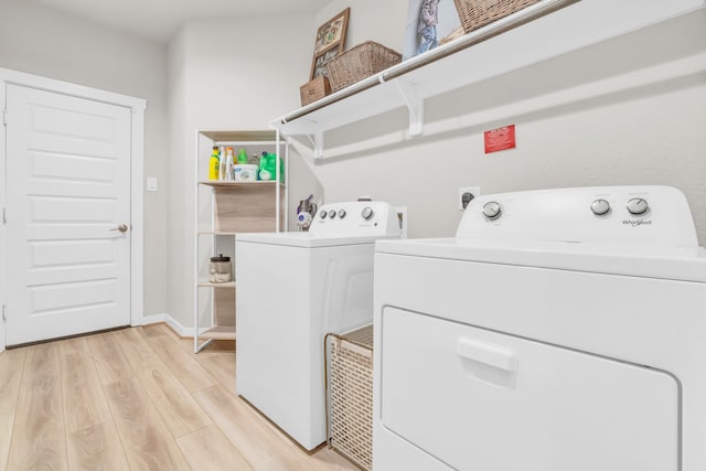 28403 Hannahs Harbor Ln, Katy, TX 77494 - laundry room featuring washing machine and clothes dryer and light wood finished floors