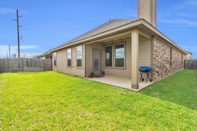 28403 Hannahs Harbor Ln, Katy, TX 77494 - back of house featuring a patio, brick siding, and a chimney
