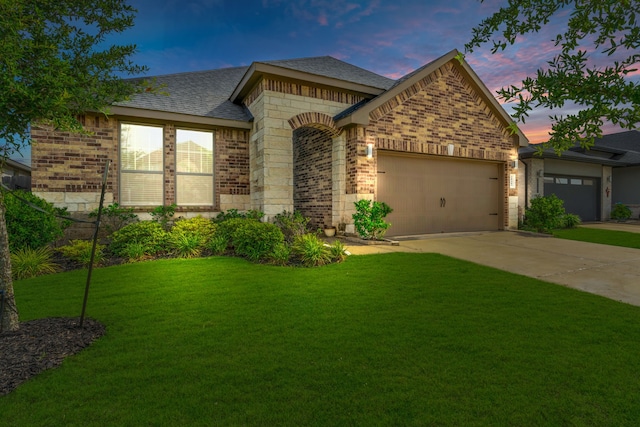 28403 Hannahs Harbor Ln, Katy, TX 77494 - view of front of property with brick siding, a garage, a front lawn, driveway, and a shingled roof