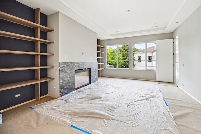 1656 Banks St, Houston, TX 77006 - bedroom featuring a high end fireplace, a tray ceiling, and baseboards