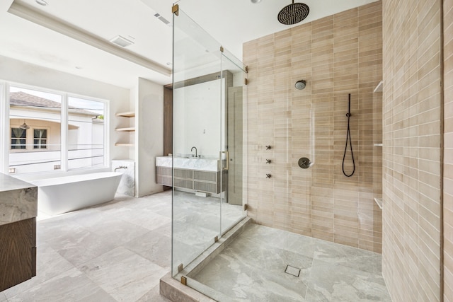 1656 Banks St, Houston, TX 77006 - full bath with a stall shower, a soaking tub, and vanity