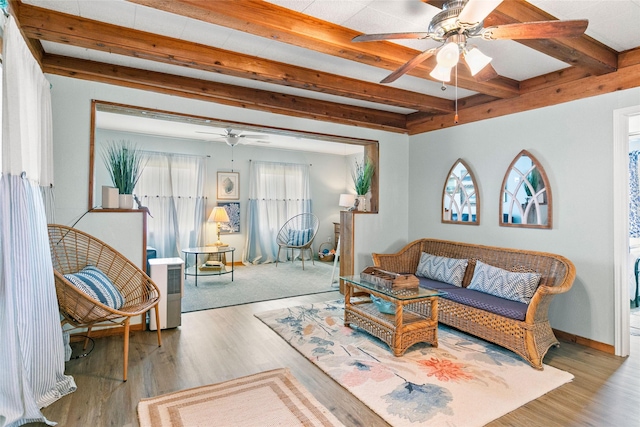 334 Bay Ave, Surfside Beach, TX 77541 - living room with ceiling fan, beam ceiling, wood finished floors, and baseboards