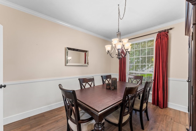14 Brywood Pl, The Woodlands, TX 77382 - dining space featuring crown molding, baseboards, a chandelier, and wood finished floors