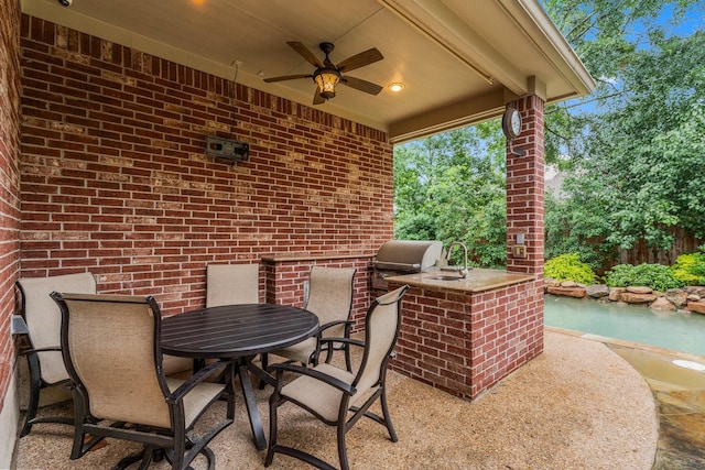 14 Brywood Pl, The Woodlands, TX 77382 - view of patio / terrace with ceiling fan, a sink, and outdoor dining area