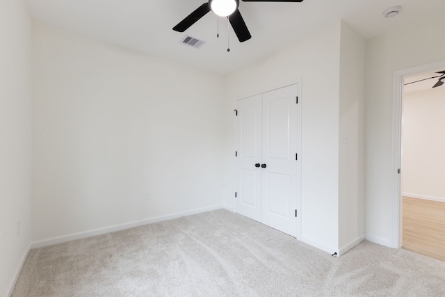 509 W Sixth St, Brenham, TX 77833 - unfurnished bedroom featuring carpet floors, baseboards, a closet, and ceiling fan