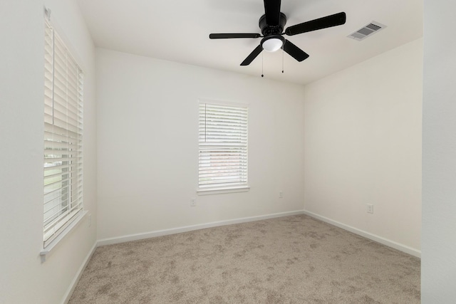509 W Sixth St, Brenham, TX 77833 - carpeted empty room with baseboards and a ceiling fan