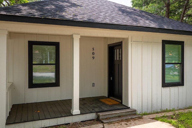 509 W Sixth St, Brenham, TX 77833 - view of exterior entry featuring roof with shingles