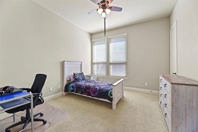 3310 Ralston Edge Ln, Houston, TX 77059 - bedroom featuring light colored carpet, an office area, baseboards, and a ceiling fan