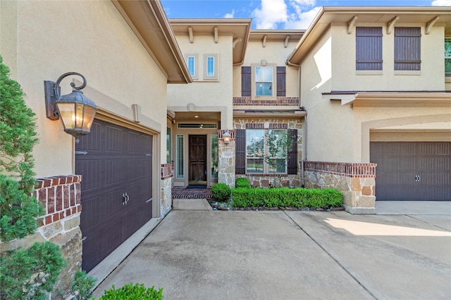 3310 Ralston Edge Ln, Houston, TX 77059 - view of front of house with a garage, stucco siding, stone siding, and driveway