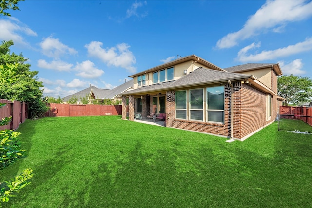 3310 Ralston Edge Ln, Houston, TX 77059 - rear view of house with a fenced backyard, brick siding, a patio area, and a shingled roof